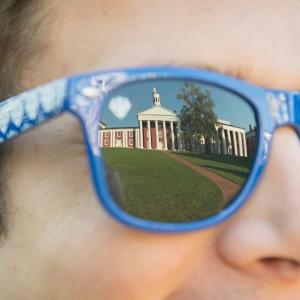 A reflection of the Colonnade in sunglasses lens